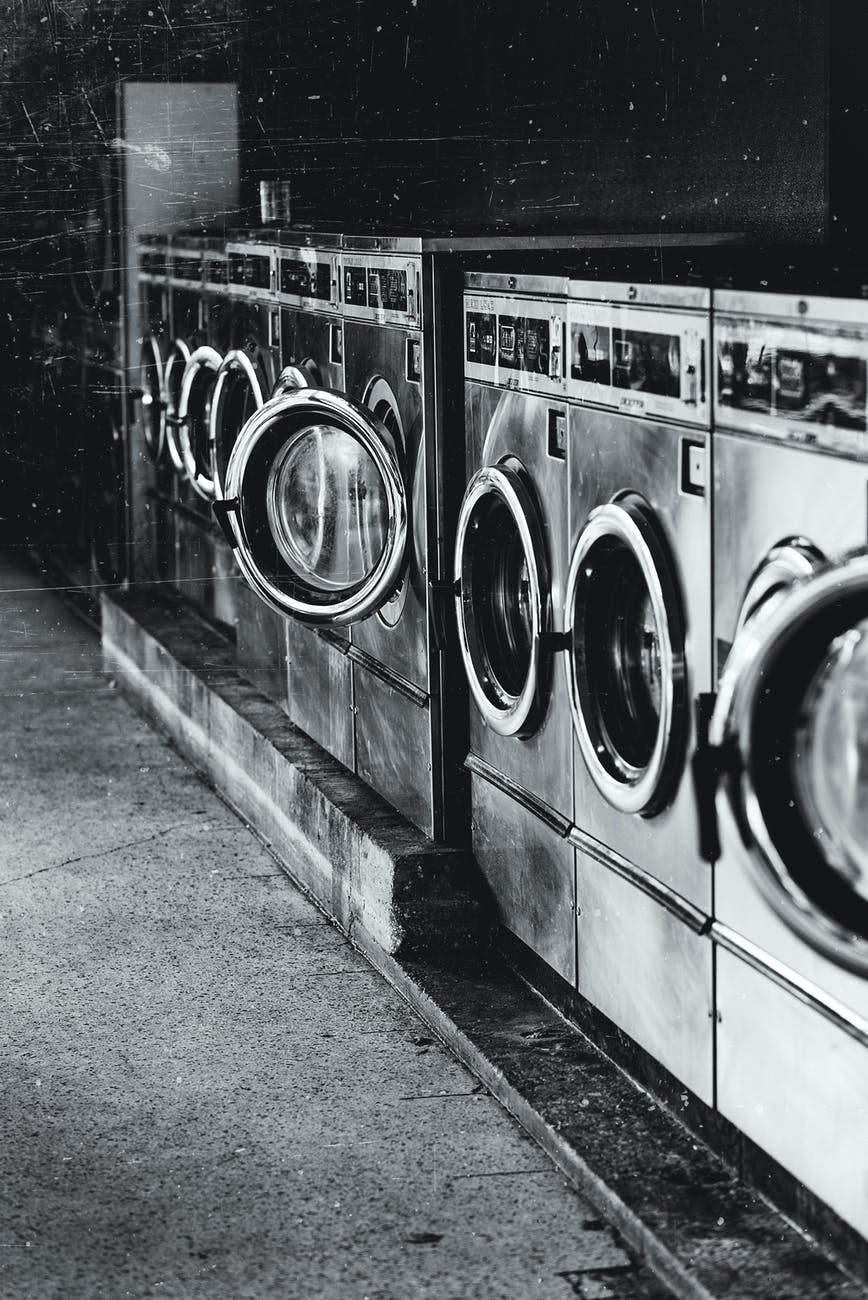 grayscale photography of front load washers