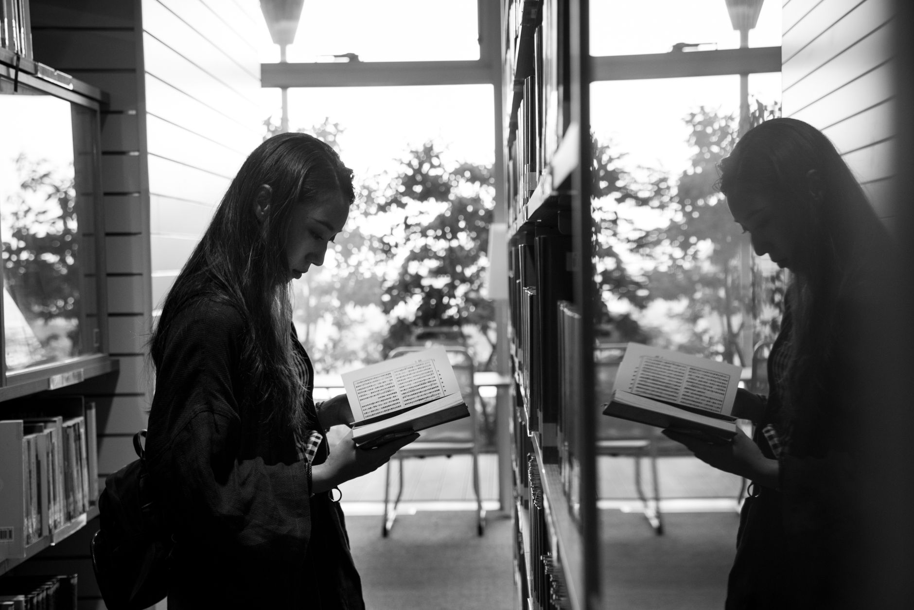a performative girl in a bookstore by Anastázie Köhlerová
